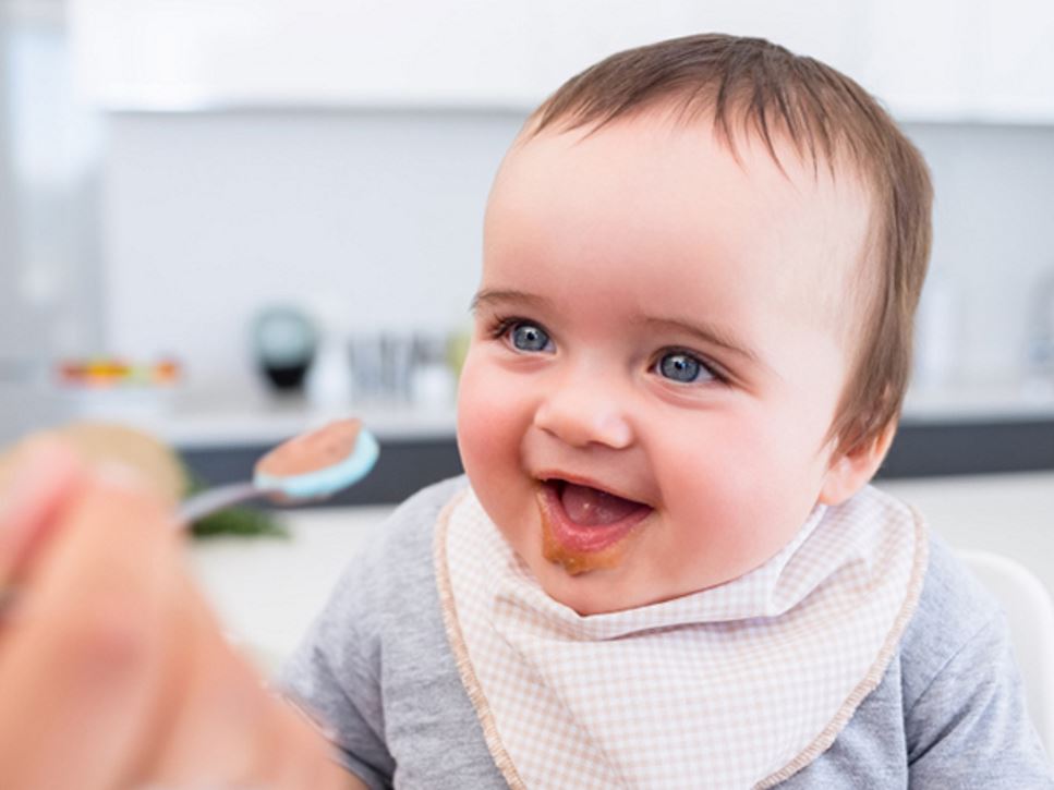 Baby eating baby food